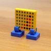The Brick Show Shop Four in a Row Printed 2x2 Tile with Stand made using LEGO parts - B3 C
